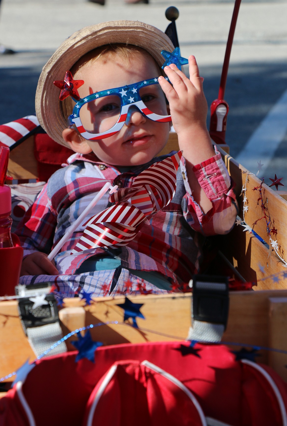 (Photo by CAROLINE LOBSINGER)
Parker Shorland, the son of Matt and Brittany Shorland of Sandpoint, kicks back as he waits for the start of the Sandpoint Lions&#146; Kids Parade Wednesday on the Fourth of July.