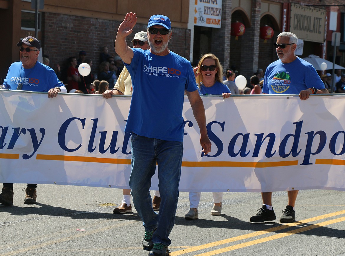 (Photo by CAROLINE LOBSINGER)Sandpoint Rotary Club members perform a drill routine as they take part in the Sandpoint Lions' Grand Parade on the Fourth of July on Wednesday.