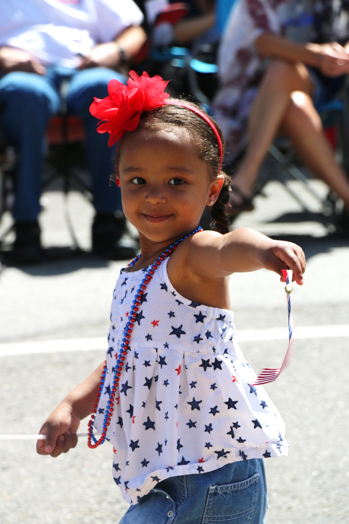 (Photo by CAROLINE LOBSINGER)
A youngster takes part in the Sandpoint Lions&#146; Grand Parade on the Fourth of July on Wednesday.