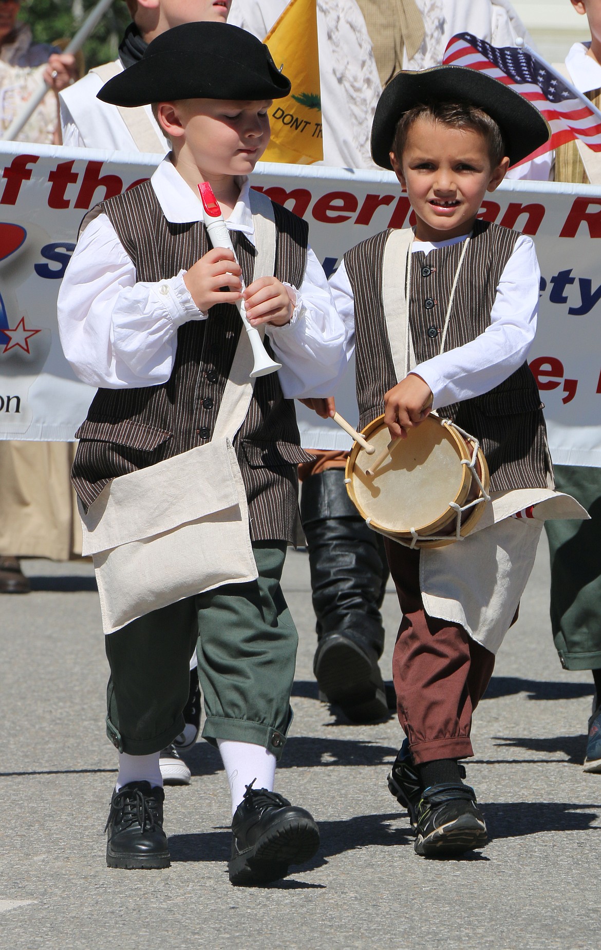 (Photo by CAROLINE LOBSINGER)
A pair of youngsters take part in the Sandpoint Lions&#146; Grand Parade on the Fourth of July Wednesday.