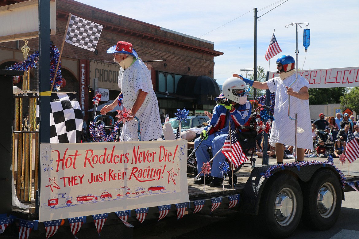 (Photo by CAROLINE LOBSINGER)Members of a float have fun at the Sandpoint Lions' Grand Parade on the Fourth of July Wednesday.