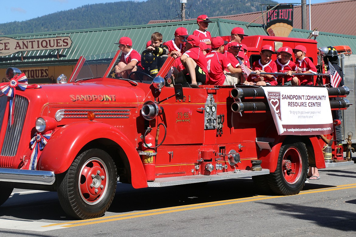 (Photo by CAROLINE LOBSINGER)Young baseball players wait for the start of the Sandpoint Lions' Grand Parade on the Fourth of July on Wednesday.