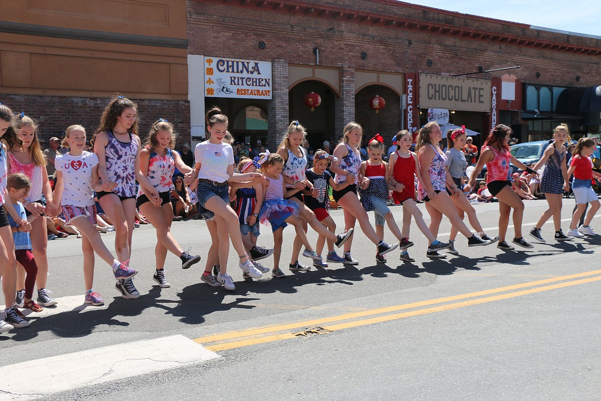 (Photo by CAROLINE LOBSINGER)Sandpoint High School dance team members and friends show their moves during the Sandpoint Lions' Grand Parade on the Fourth of July Wednesday.