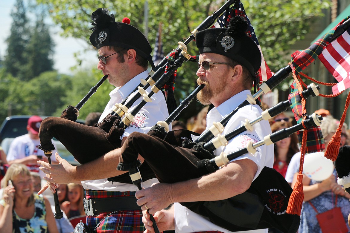 (Photo by CAROLINE LOBSINGER)Members of the Albeni Falls Pipe &amp; Drum Band members play the bagpipes as they take part in the Sandpoint Lions' Grand Parade on the Fourth of July on Wednesday.