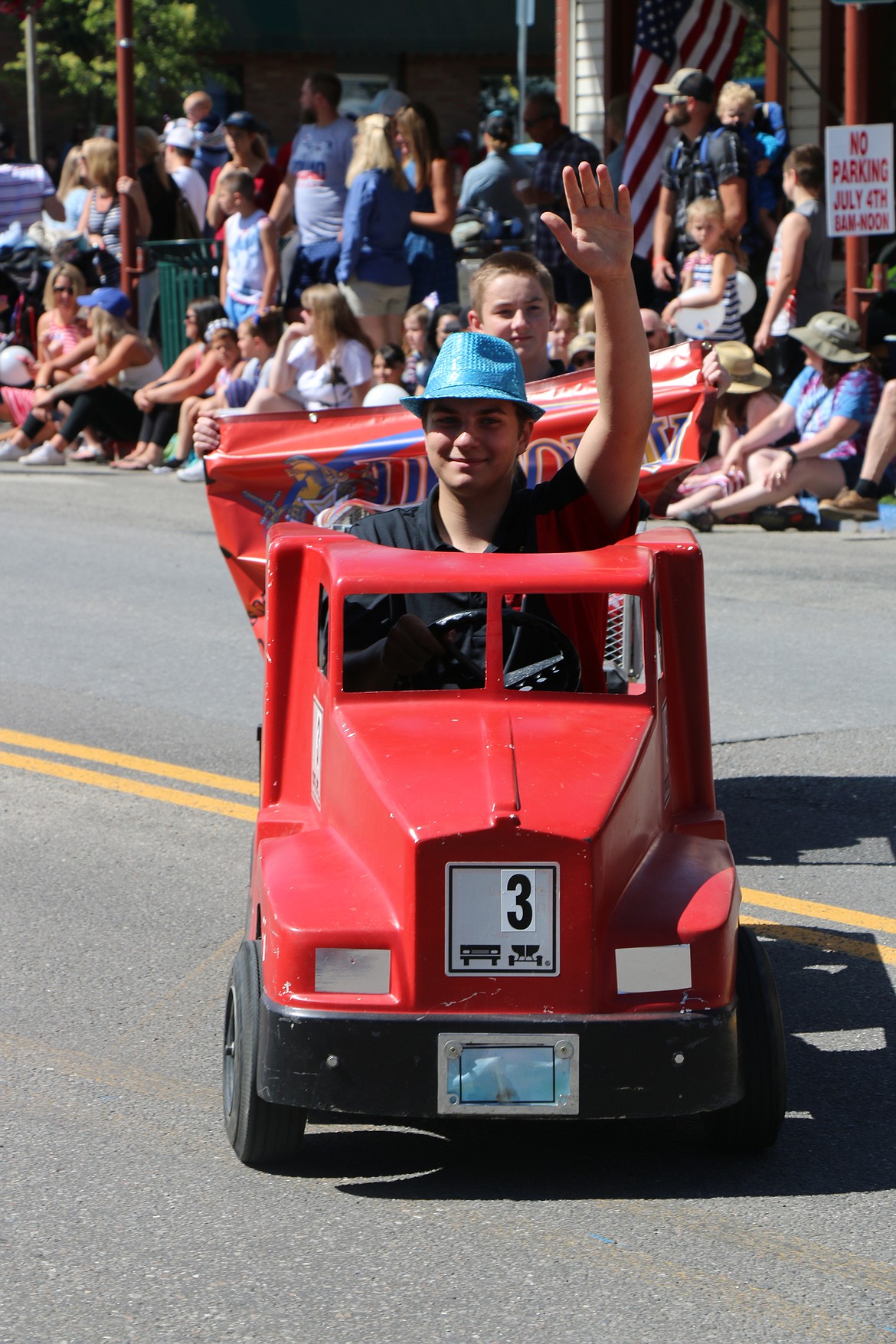 (Photo by CAROLINE LOBSINGER)A parade participant makes their way down First Avenue during the Sandpoint Lions' Grand Parade on the Fourth of July Wednesday.