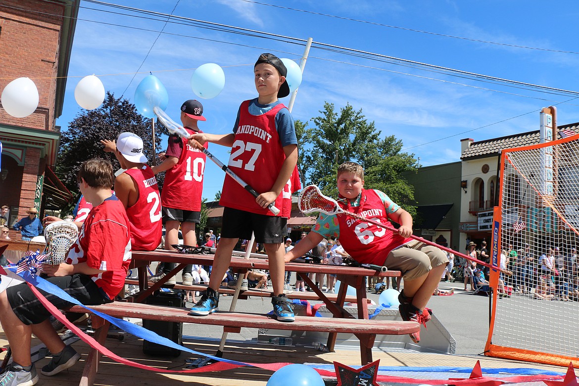 (Photo by CAROLINE LOBSINGER)Members of the Sandpoint Lacrosse program show their game face during the Sandpoint Lions' Grand Parade on Wednesday.