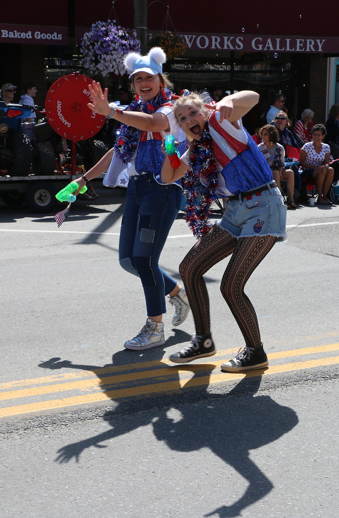 (Photo by CAROLINE LOBSINGER)Distinguished Young Women court members mug for the camera as they take part in the Sandpoint Lions' Grand Parade on the Fourth of July on Wednesday.