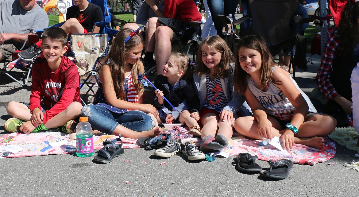 (Photo by CAROLINE LOBSINGER)
A group of youngsters take in the action during the Sandpoint Lions&#146; Grand Parade on the Fourth of July Wednesday.