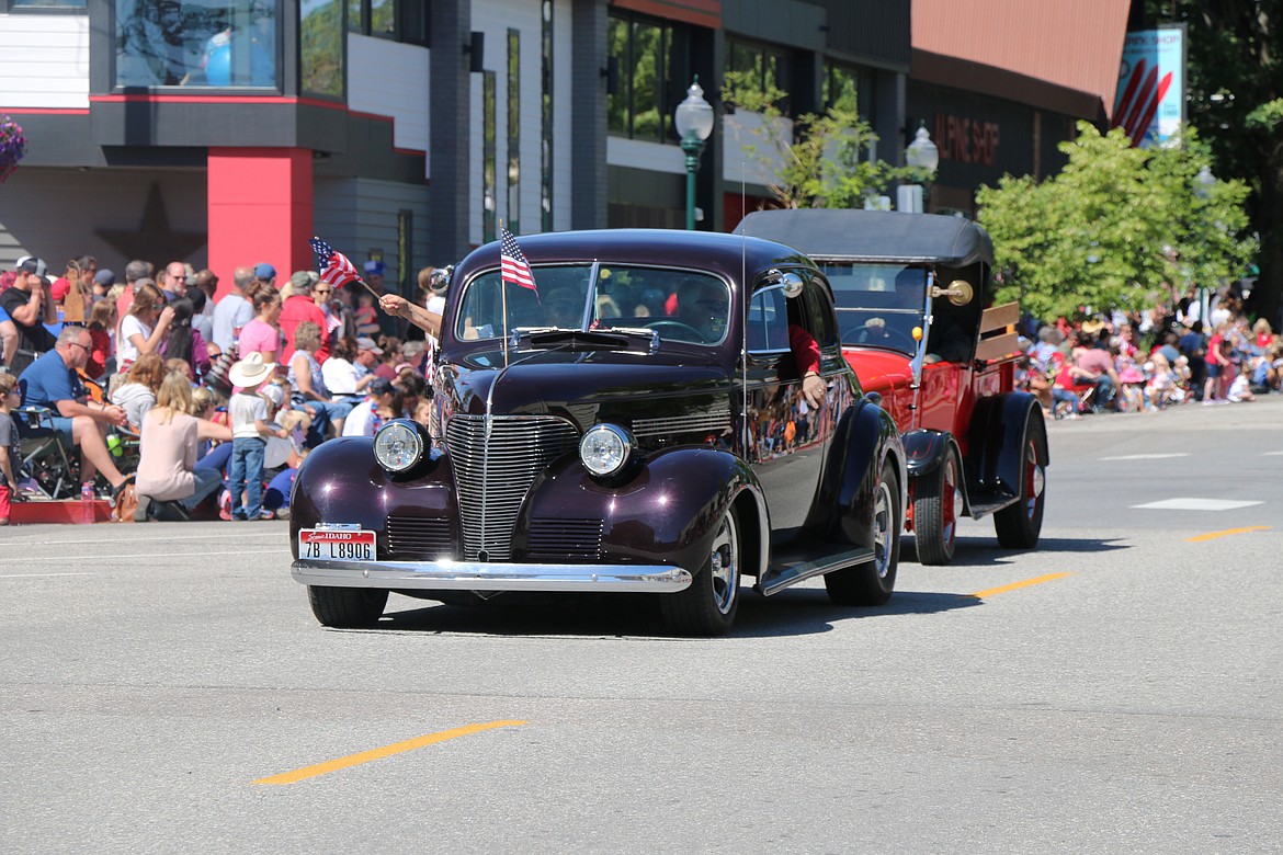 (Photo by CAROLINE LOBSINGER)Sandpoint Injectors members drive down Church Street during the Sandpoint Lions' Grand Parade on the Fourth of July Wednesday.