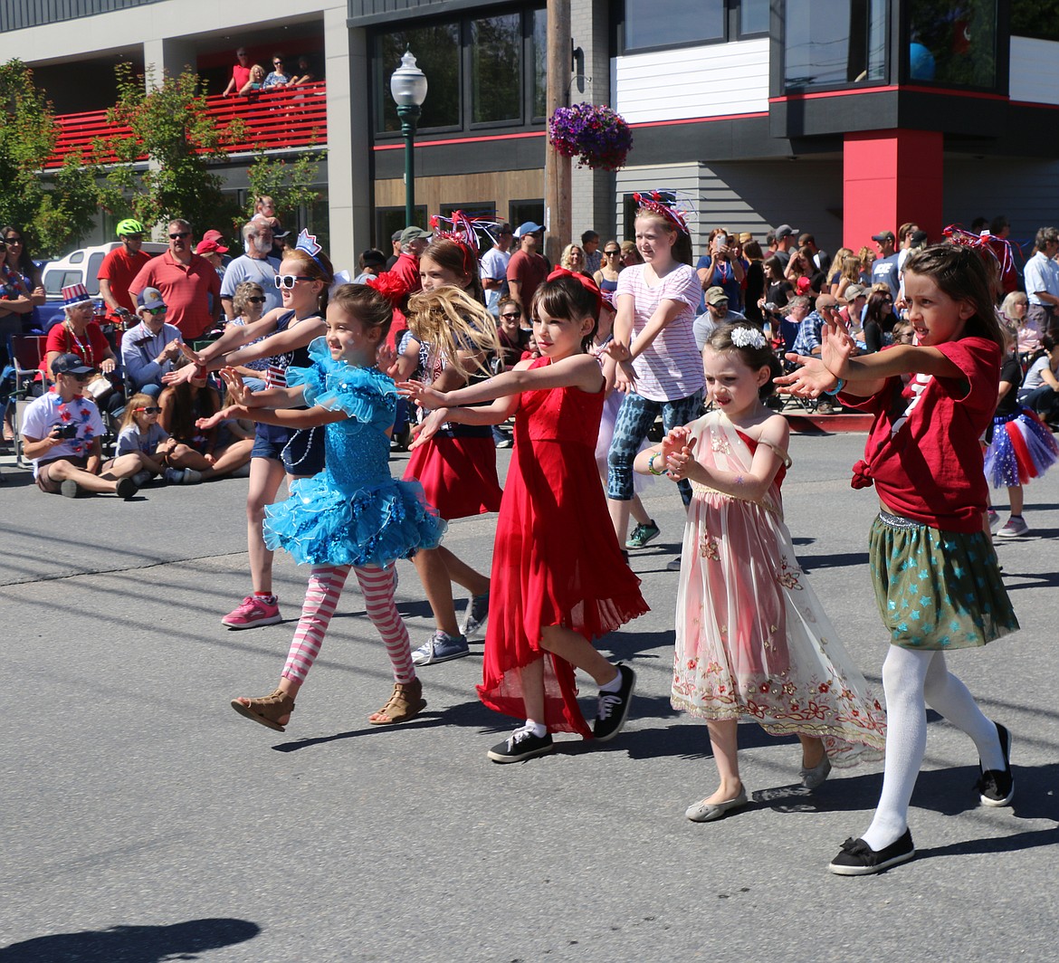 (Photo by CAROLINE LOBSINGER)Members of a local dance group perform during the Sandpoint Lions' Grand Parade on the Fourth of July on Wednesday.