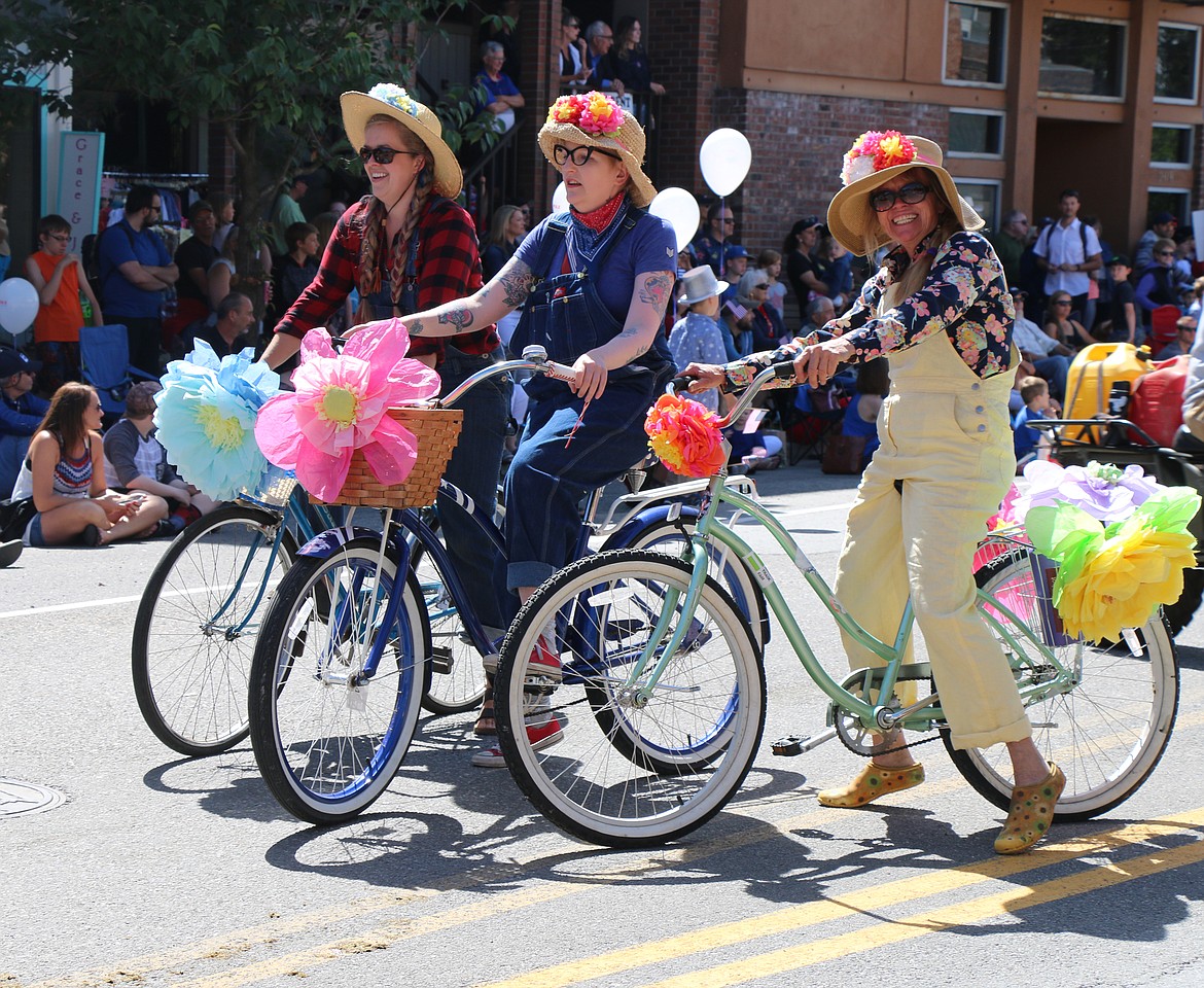 (Photo by CAROLINE LOBSINGER)Parade participants have fun riding down First Avenue as they take part in the Sandpoint Lions' Grand Parade on the Fourth of July on Wednesday.