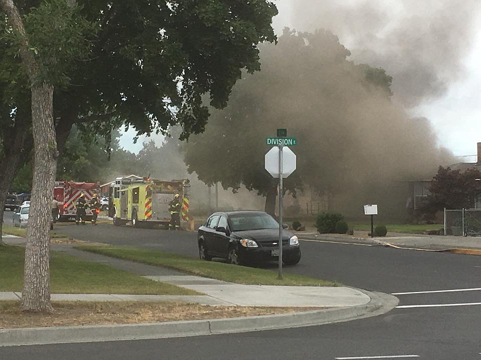 Grant County's Sheriff's Office/courtesy photo Firefighters battle Wednesday's fire in Ephrata that was reportedly caused by fireworks.