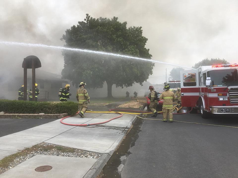 Grant County's Sheriff's Office/courtesy photo Firefighters battle Wednesday's fire in Ephrata that was reportedly caused by fireworks.