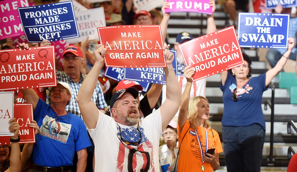 Oliver Whipple of Bigfork holds a sign and cheers at the start of the President Trump Rally in the Four Seasons Arena in Great Falls on Thursday, July 5.(Brenda Ahearn/Daily Inter Lake)