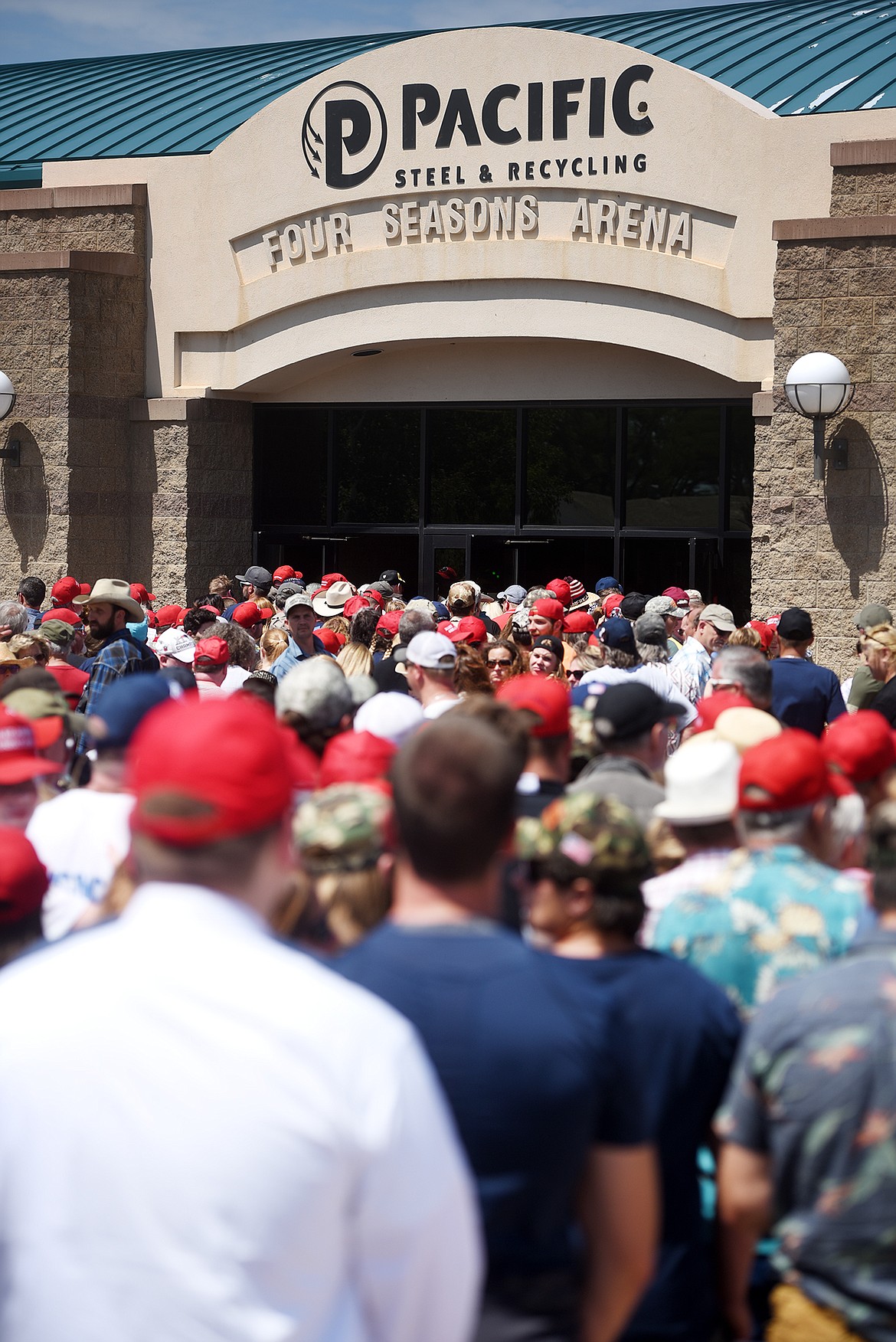 Thousands of people lined up to enter the Four Season Arena several hours before the arrival of President Donald Trump on Thursday, July 5, in Great Falls.(Brenda Ahearn/Daily Inter Lake)