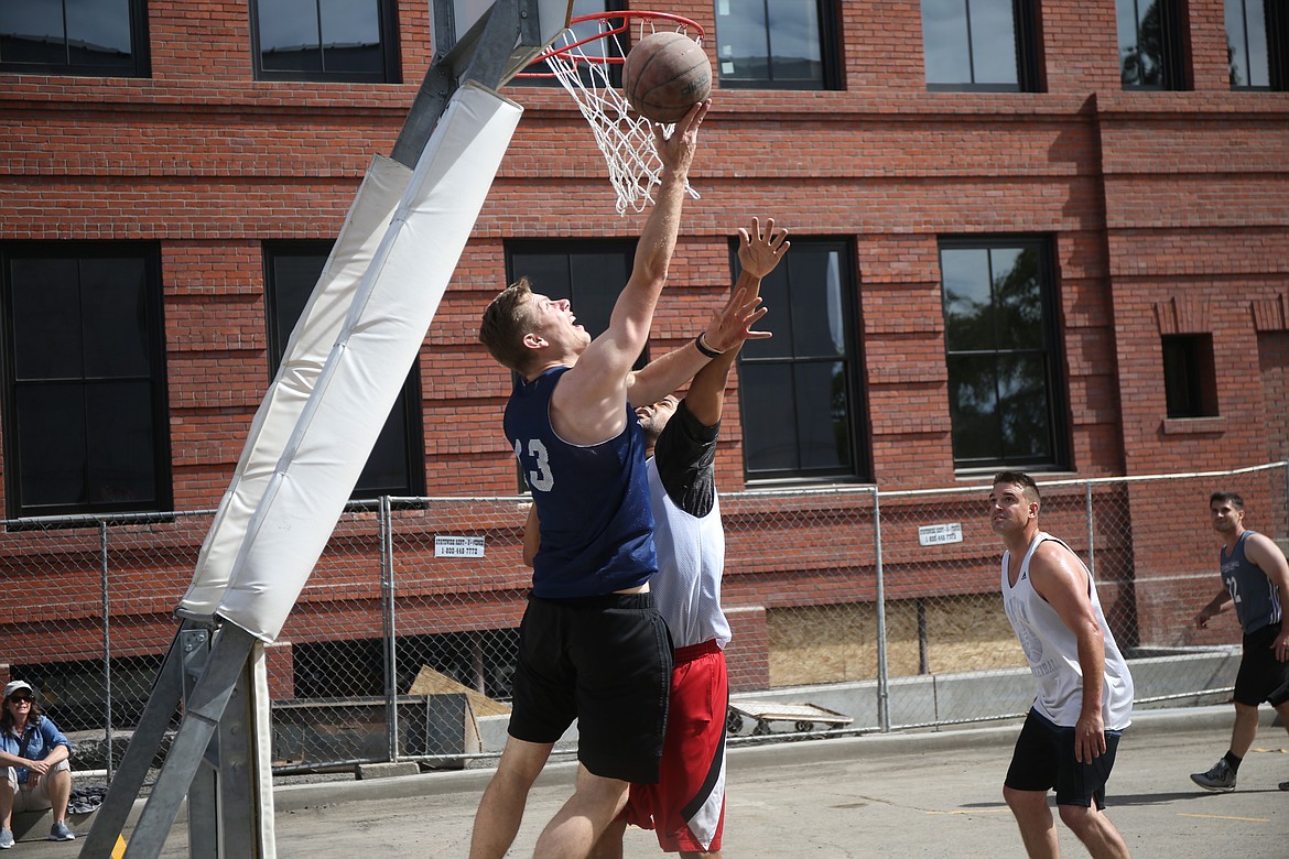 Mark Smyly of Wapbopoloobos attempts to put back a rebound during an opening-round game at Hoopfest.