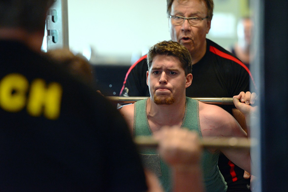 Powerlifter Chandler Krahn is spotted by coach Mark Kuhr during a workout at The Wave Aquatic &amp; Fitness Center in Whitefish on Tuesday, June 26. (Casey Kreider/Daily Inter Lake)