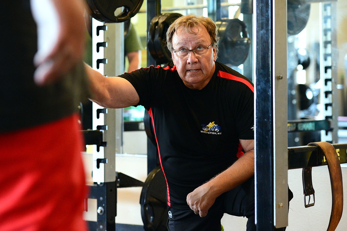 Whitefish Thunder head powerlifting coach Mark Kuhr speaks with Sylvester Vermillion during a workout at The Wave Aquatic &amp; Fitness Center in Whitefish on Tuesday, June 26. (Casey Kreider/Daily Inter Lake)