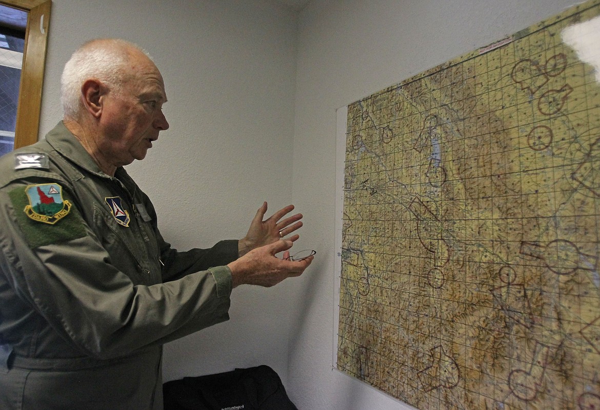 Civil Air Patrol Col. Bob Kirkwood uses a map to demonstrate different search routes Saturday morning at the Civil Air Patrol station in Hayden during a simulated earthquake training. (DEVIN WEEKS/Press)