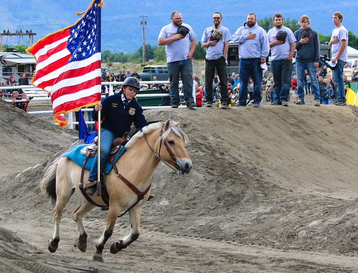 Photo by MANDI BATEMAN
Allie Sandlin urged her Norwegian Fjord around the arena, proudly sporting the stars and stripes as the National Anthem rang through the speakers.