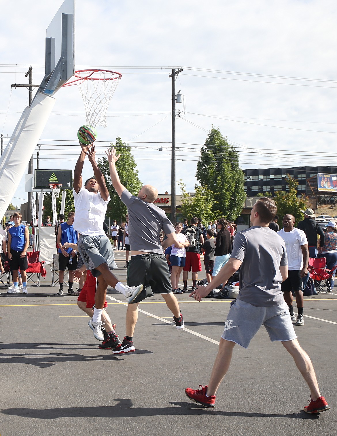 JASON ELLIOTT/Press
Deon Watson of Super Soakers attempts a jumper during an opening round game at Hoopfest on Saturday in the Spokane Arena parking lot.