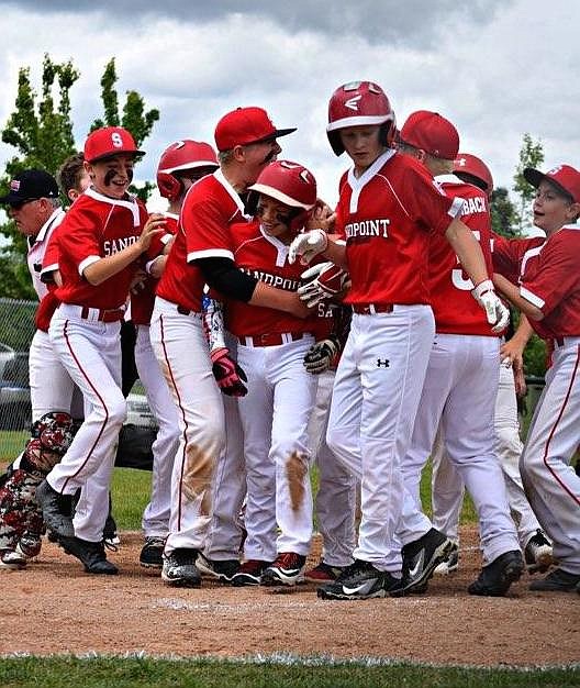 (Courtesy photo)
Jorden Tyler gets mobbed by teammates after ripping a home run for Sandpoint in the Majors District 1 Little League All-Star Tournament last weekend in Coeur d&#146;Alene. The team opened with an 11-4 win over Post Falls, then routed Silver Valley 19-0, before falling 8-5 to Lewiston in the third day. With power bats that accounted for four home runs, and a pitching staff that allowed just 12 runs in three games, Sandpoint will be in action again next weekend, with noon games scheduled for Saturday and Sunday at Canfield Park, against Coeur d&#146;Alene and Hayden, respectively.