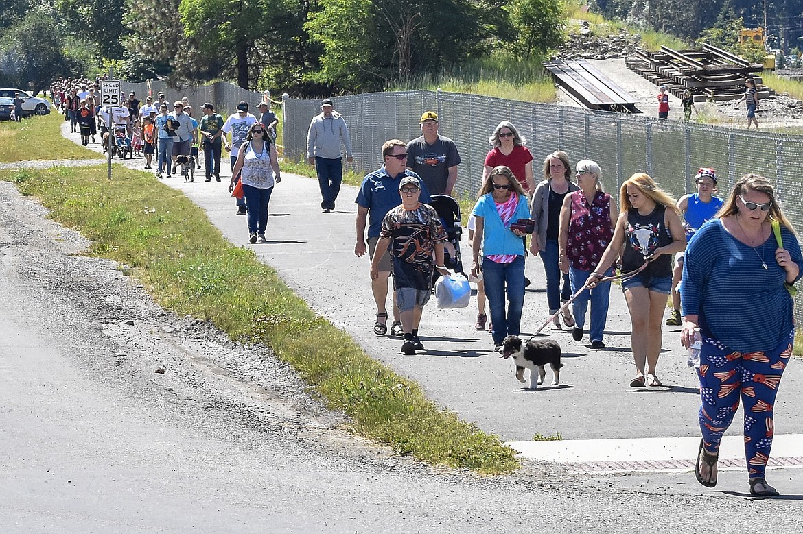 The walking path that leads to Roosevelt Park in Troy is flooded with traffic after the Independence Day Parade on July 4, as visitors make their way to the rest of the day&#146;s festivities. (Ben Kibbey/The Western News)