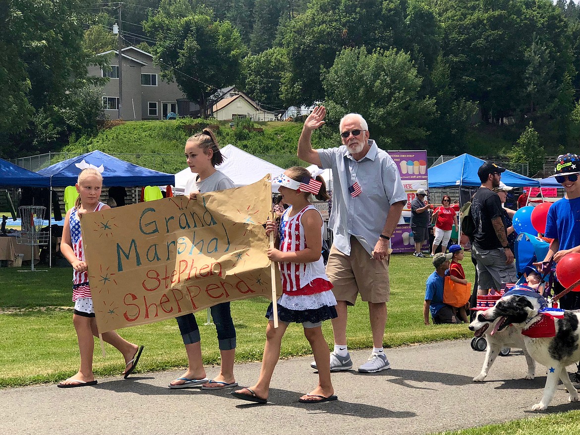 Photo by JOSH MCDONALD/ 
Grand marshal Stephen Shepperd leads the kids and pets parade that kicked off the festivities in Kellogg. The parade began and Silver Mountain and ended at the City Park.