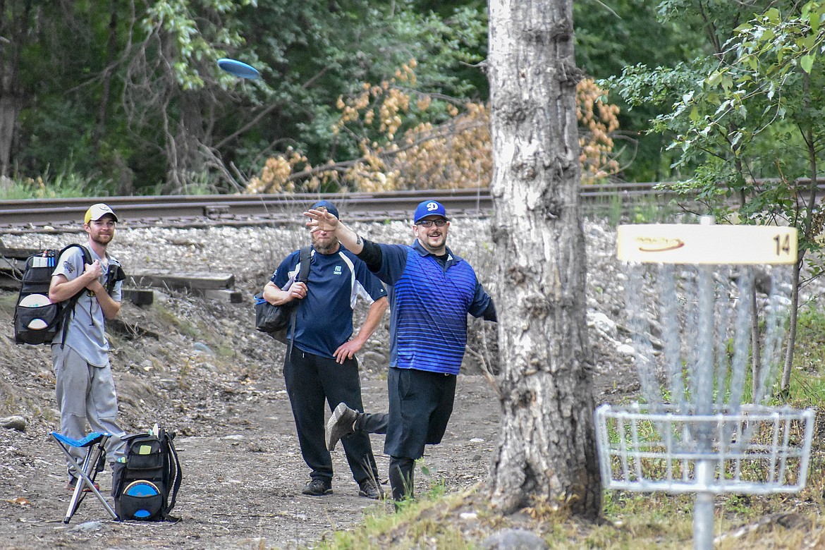 Derrik Coulter from Spokane putts on the 14th hole at the Timber Beast disc golf course in Troy during the Timber Beast Disc Golf Tournament on Saturday, June 30. (Ben Kibbey/The Western News)