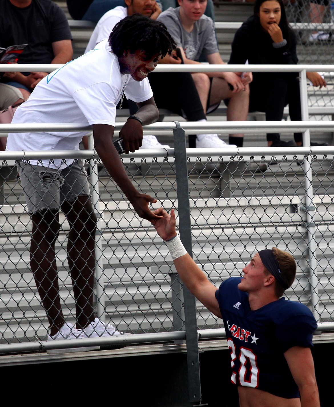 Rodney Harwood/Columbia Basin Herald
Hunter Cruz takes a minute with fellow Moses Lake graduate Gio Walker during the East-West All-State Classic Friday night in Spokane.