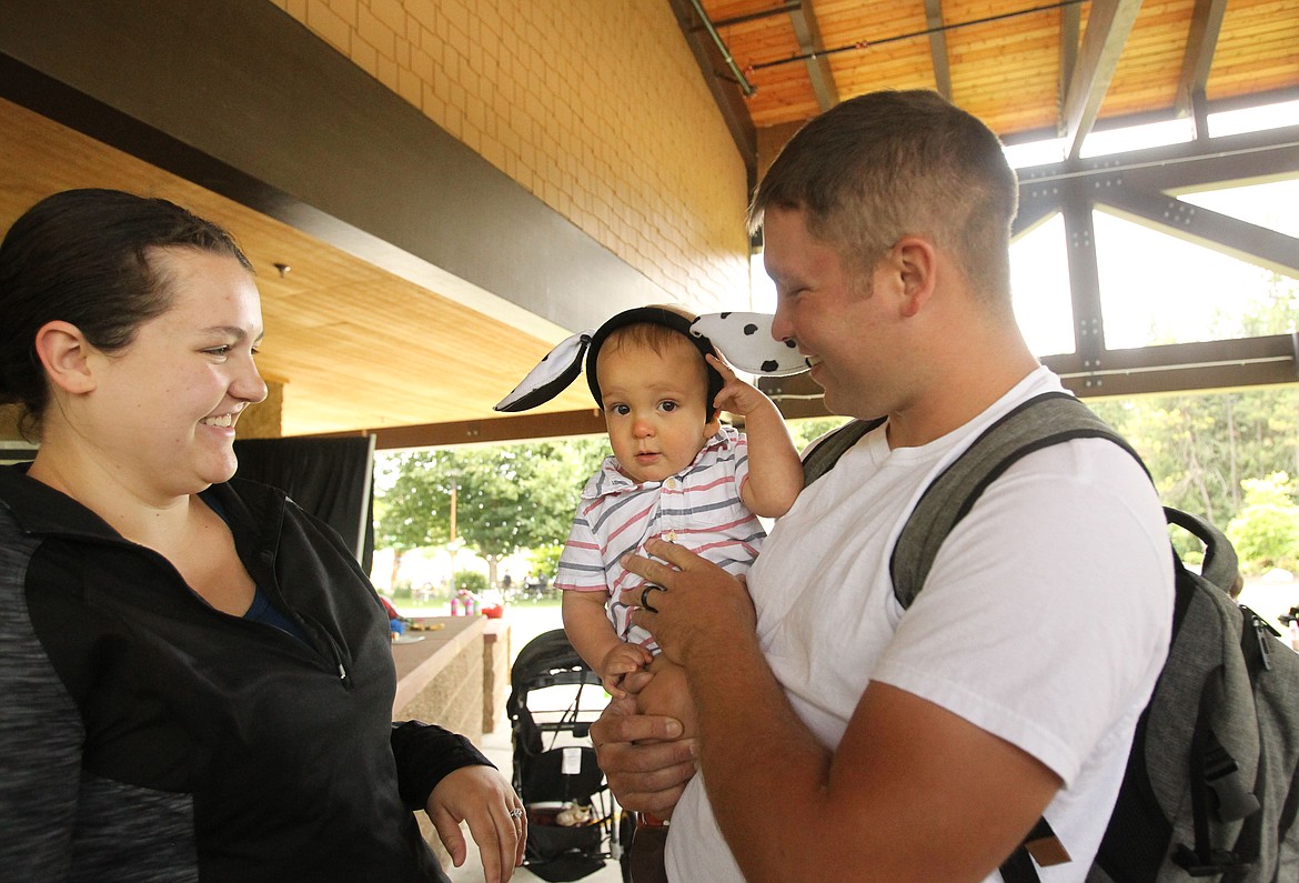 Nicole and Matt Kelso's 10-month-old son, Theo, is unsure about the ears his mom placed on his head as he eyes the camera Saturday afternoon during Kootenai Heath's Neonatal Intensive Care Unit (NICU) reunion in McEuen Park. The Hayden family shared their story about Theo's early arrival last summer and the six weeks they spent in the NICU as he grew strong and healthy enough to be released from the hospital. Nicole used one word to describe how she felt when her baby came home: &quot;Free.&quot; (DEVIN WEEKS/Press)