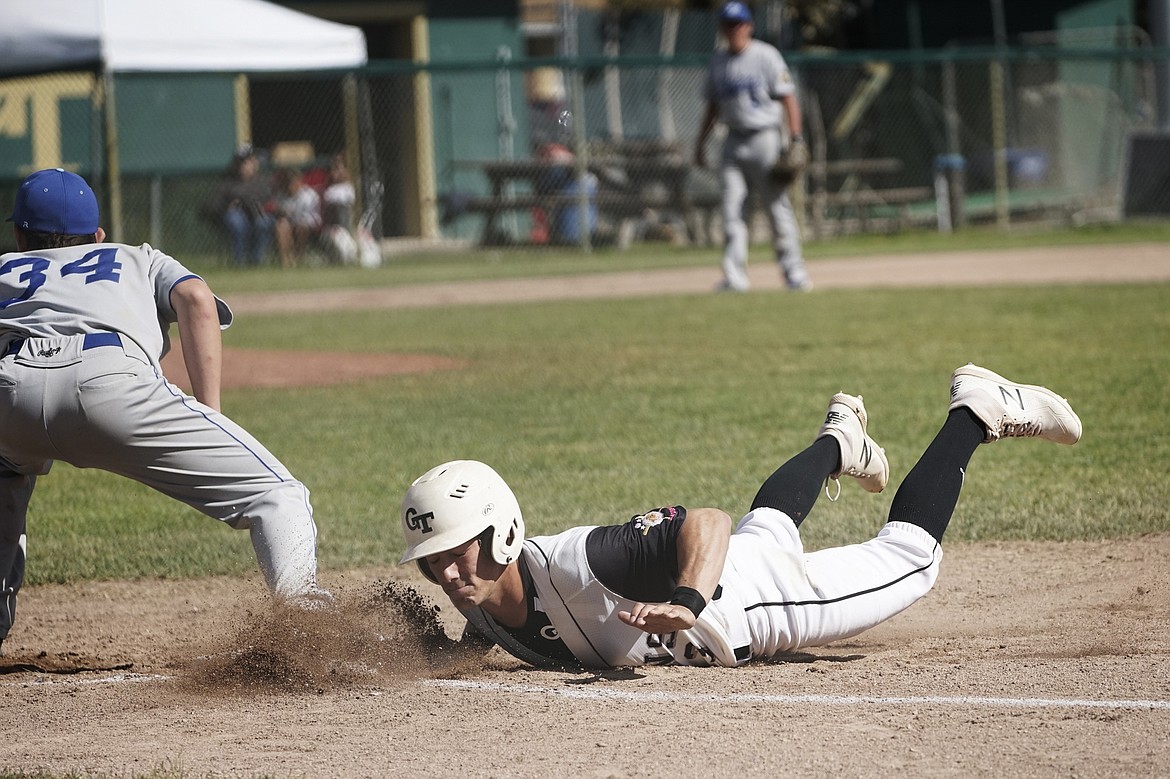 Tom Hellwig avoids a pickoff attempt during a Tuesday night doubleheader against Libby at Memorial Field. (Daniel McKay photos/Whitefish Pilot)