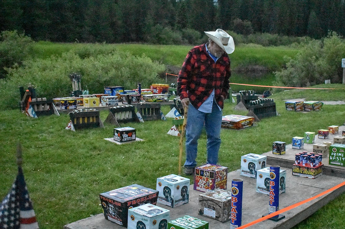 Joe Wade takes a look over his set up before the annual Fourth of July fireworks display on Saturday, June 30. (Ben Kibbey/The Western News)