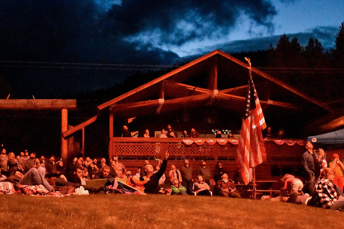 The crowd at the Yaak River Tavern and Mercantile are illuminated by the rocket&#146;s red glare during the annual Fourth of July fireworks display on Saturday, June 30. This year&#146;s display was the final one for Joe Wade, who has put on the show for 20 years. (Ben Kibbey/The Western News)
