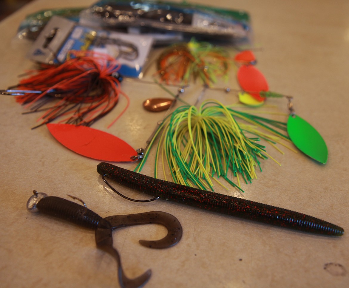 RALPH BARTHOLDT/Press
Jordan Smith at Fins and Feather Tackle Shop and Guide Service recommends using worms for largemouth and smallmouth bass in July and big spinners fished along weed lines for pike.