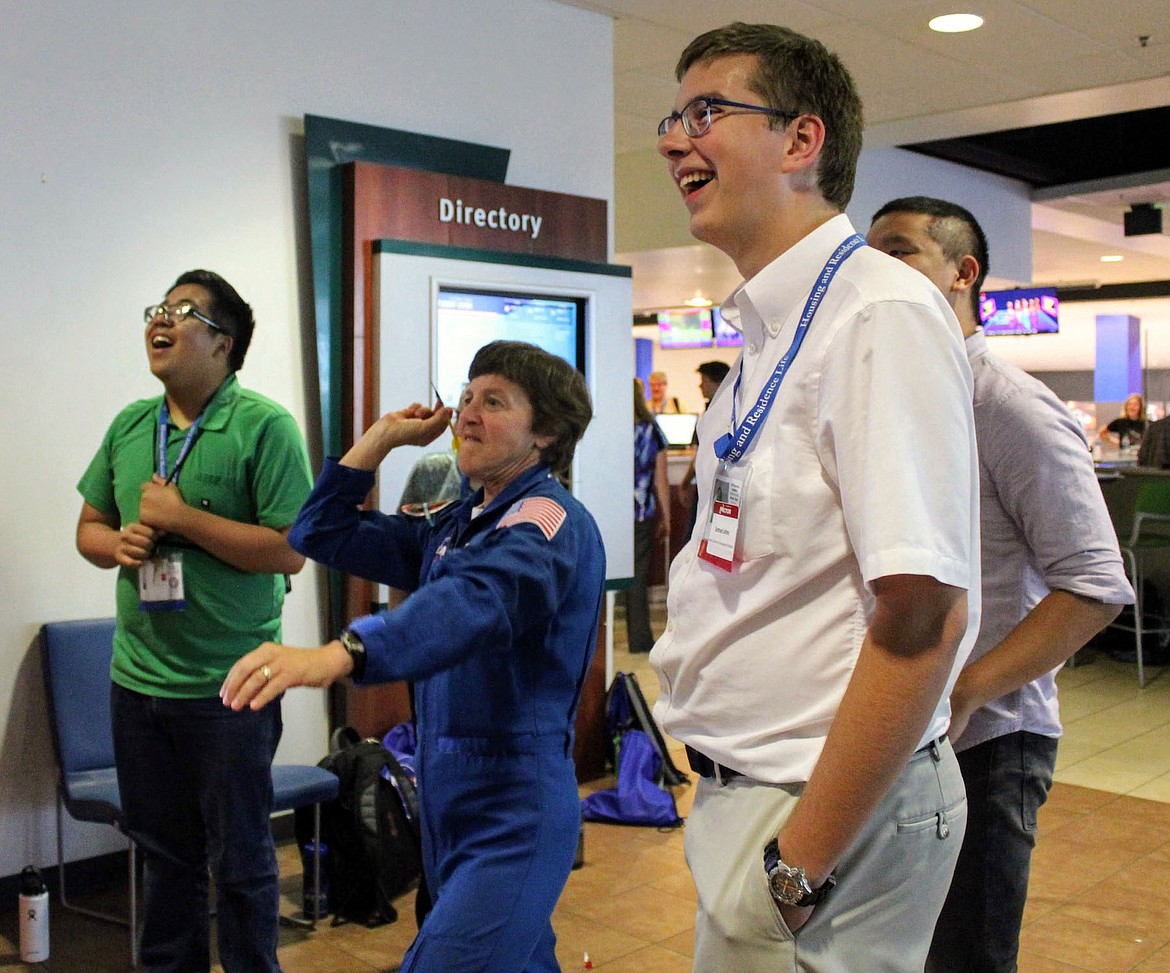 Courtesy IDAHO SCIENCE AND AEROSPACE SCHOLARS
NASA Astronaut Wendy Lawrence played darts with Samuel Johns and other Idaho Science and Aerospace Scholars at Ames, Calif., earlier this month.