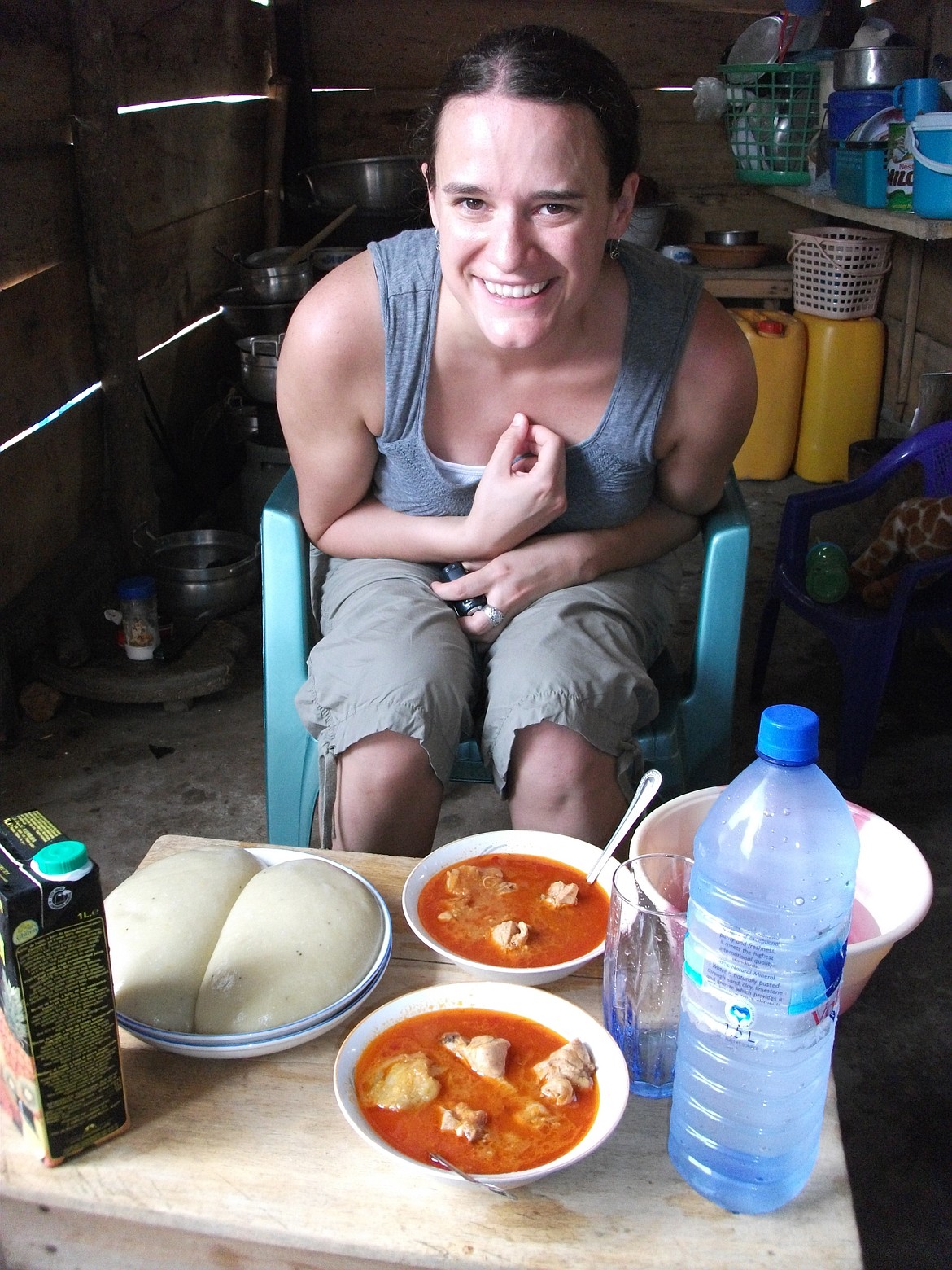 Sarah Walker smiles over a meal she was invited to enjoy in a patient&#146;s home in Ghana.