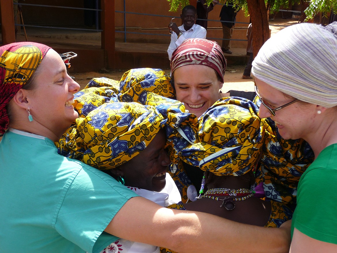 Sarah Walker and her fellow nurses give women they&#146;ve cared for  a hug during a ceremonial send-off.