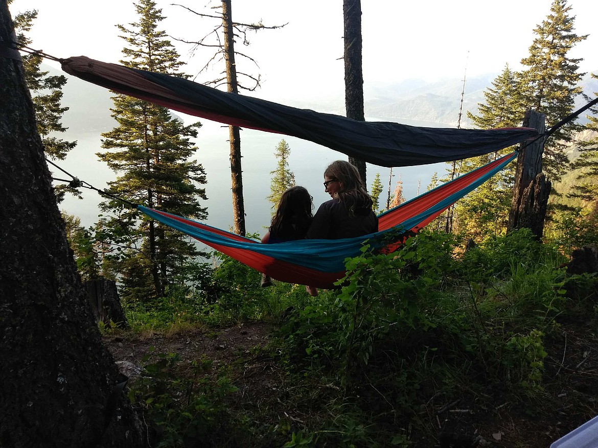 Wilmoth family members enjoy the view of Lake Pend Oreille from hammocks at Bernard Overlook. (Photo by JASON WILMOTH)
