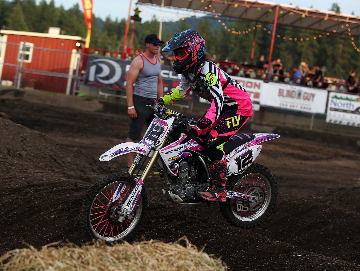 Alyson Brown rides over speed bumps in the Little Girls Arenacross race last Friday.