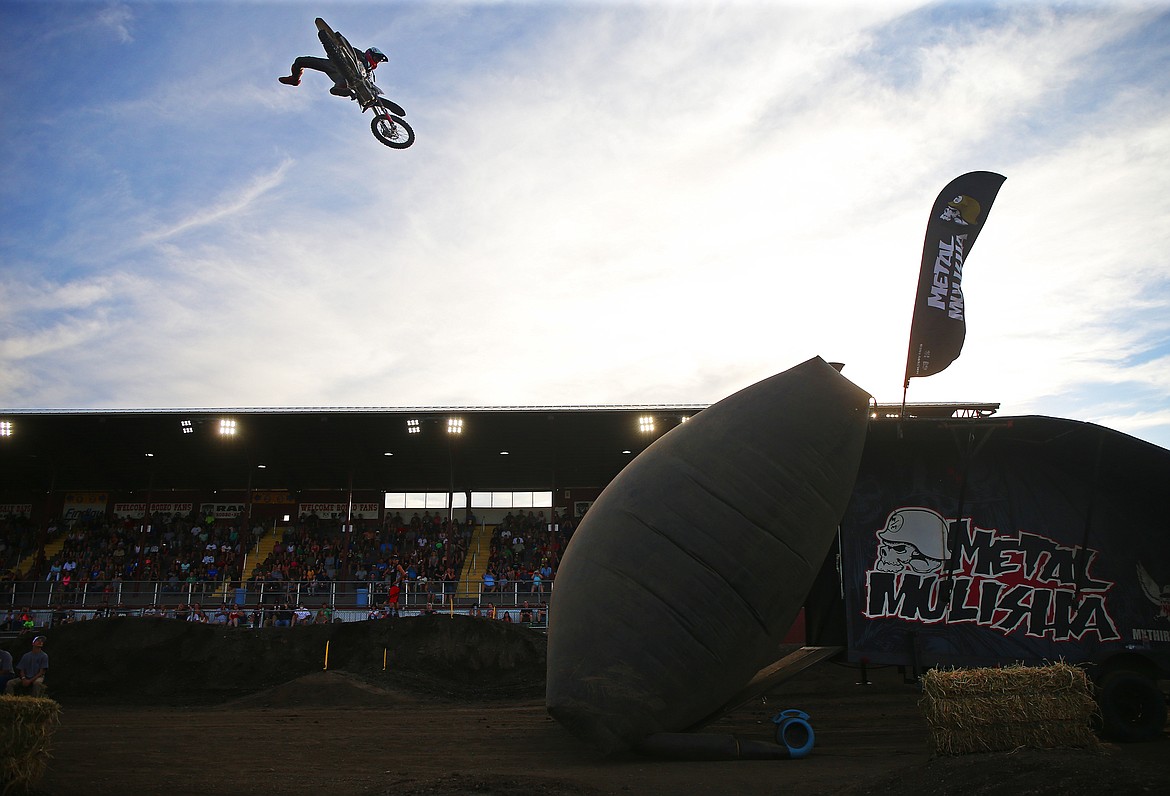 Rider Sean Nielsen performs a trick during the Metal Mulisha Freestyle Motocross Challenge Friday night at the Kootenai County Fairgrounds.