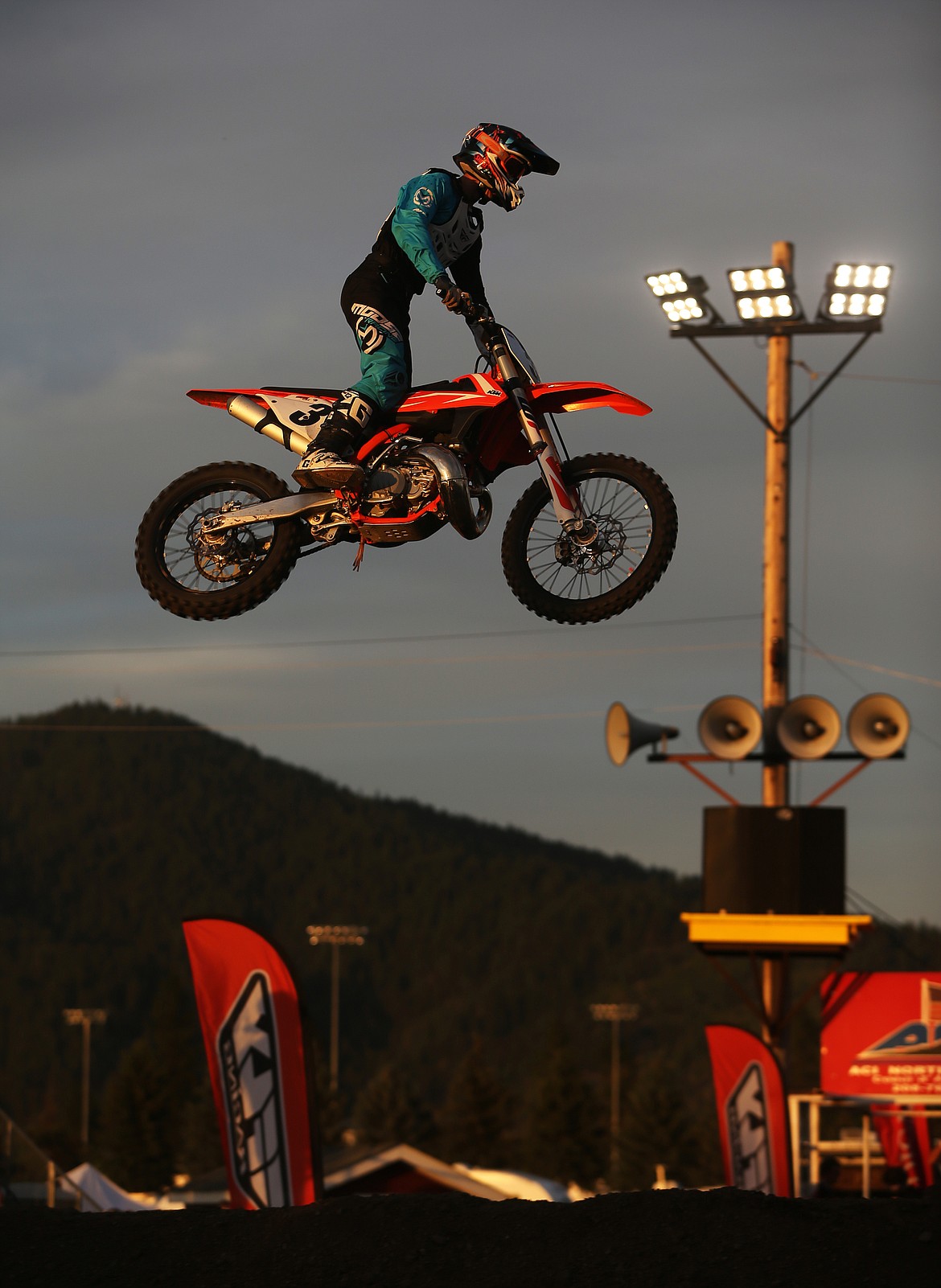 Trace Hanson of St. Maries flies through the air off a jump in the Intermediate Arenacross race Friday night.