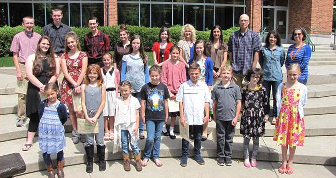 (Courtesy photo)
Winners of the 2018 Julie Meier Writers Competition held recently at the Coeur d&#146;Alene Library include Aubrey Keinert of Priest River. Picture in the front row, from left, are Aubrey Keinert, Maren Larson, Mikayla Moore, Gabrielle Hill, Alexander Beresford-Wood, Trent Roberts, Verity Zichek, and Alyssa Harrison. Pictured in the second row, from left, are Sophie Nungesser, Samantha Hayes, Jane Robinette, Mecedesz Juhasz, Emma Crownhart
and Lillian Syren. Pictured in the third row, from left, are Isaac Harrison, Isaiah Harrison, Samuel Cuentas, Jessica Gates, Lyssa Bivens, Sherry Groeschl, Victoria Collins, Kevin Zirker, Angela Gates, and Rebecca Crouse. Not pictured are Peyton Jerome, Brenda Bergelin, and Zachery Linford.