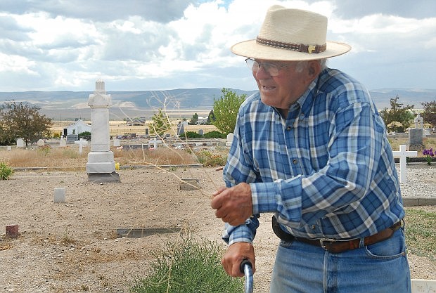 Photo courtesy of LAURIE WELCH/TIMES-NEWS
Keith Warr, former sexton of the Oakley cemeteries, holding a piece of tumbleweed at Oakley Cemetery, where Deep Creek murder victims Daniel Cummings and John Wilson are buried.