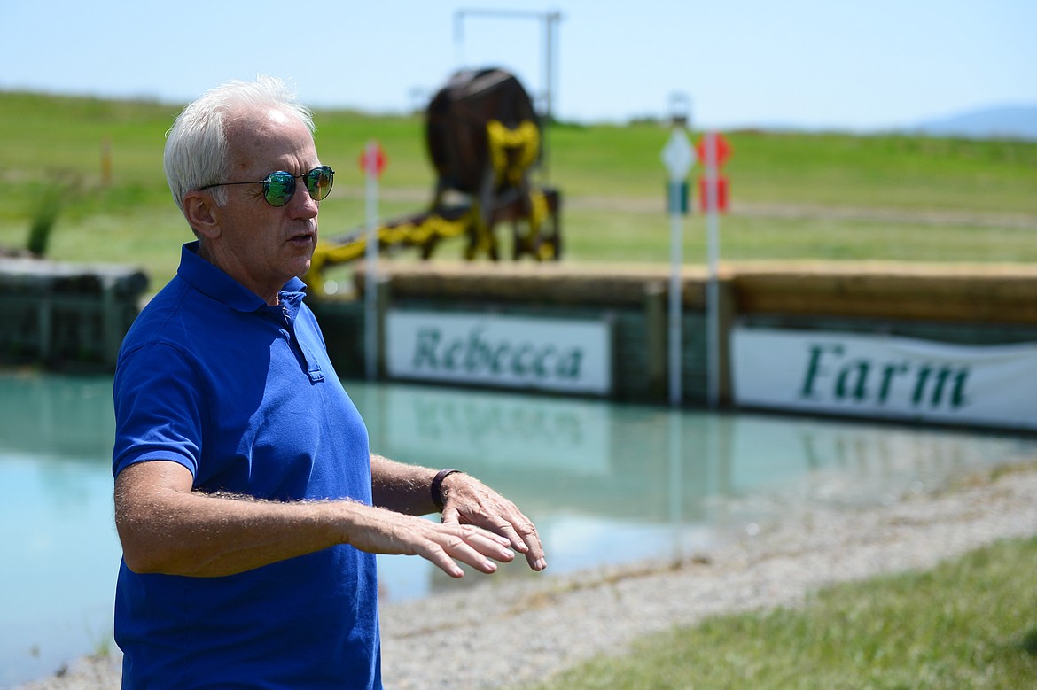 Course designer Ian Stark describes a water obstacle on the course for The Event at Rebecca Farm on Wednesday. (Casey Kreider/Daily Inter Lake)