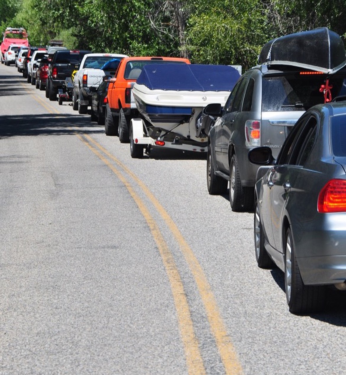 Cars back up by the dozens, waiting to have their vessels inspected before entering the water.