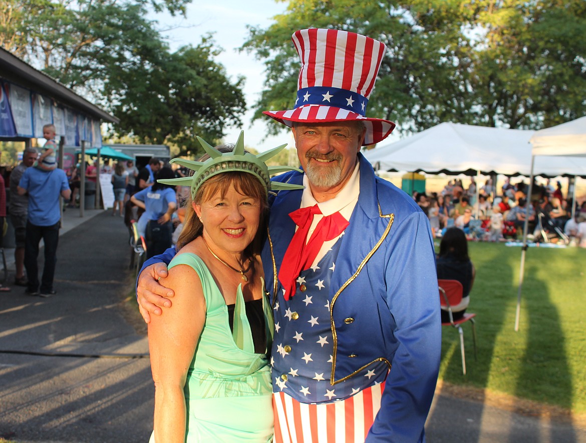 Emry Dinman/Columbia Basin Herald
Dressed in complimentary Uncle Sam and Lady Liberty costumes, Gary and Leslie Fanning were grand marshals for the 2018 Royal City Summerfest.