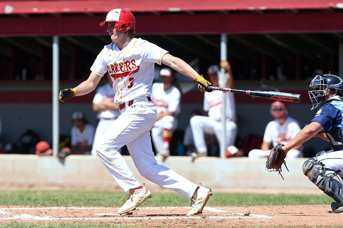 Kalispell Lakers AA's Eric Seaman drives in a run with an RBI single in the bottom of the second inning against Great Falls AA on Saturday. (Casey Kreider/Daily Inter Lake)