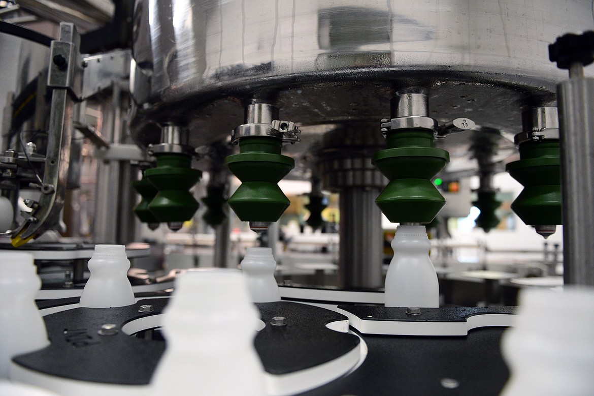 Pints of milk are filled on a production line at Kalispell Kreamery on Thursday, July 5. (Casey Kreider/Daily Inter Lake)