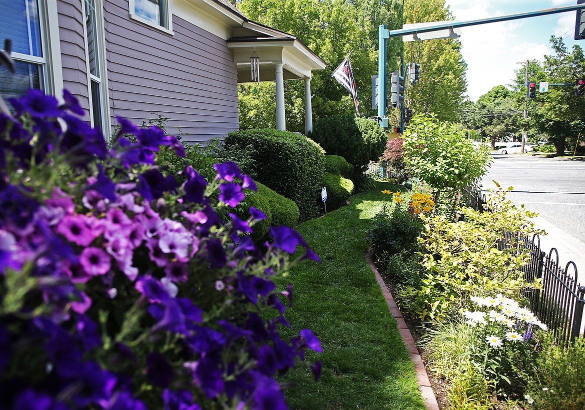 The 21st annual Coeur d'Alene Garden Club Garden Tour is this Sunday, rain or shine, from 11 a.m. to 4 p.m. Six private gardens, including the Beglingers' at the corner of Sherman Avenue and 11th Street, will be on the tour. (LOREN BENOIT/Press)